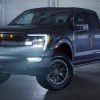 2021 Roush Ford F-150 parked in a dark smokey room