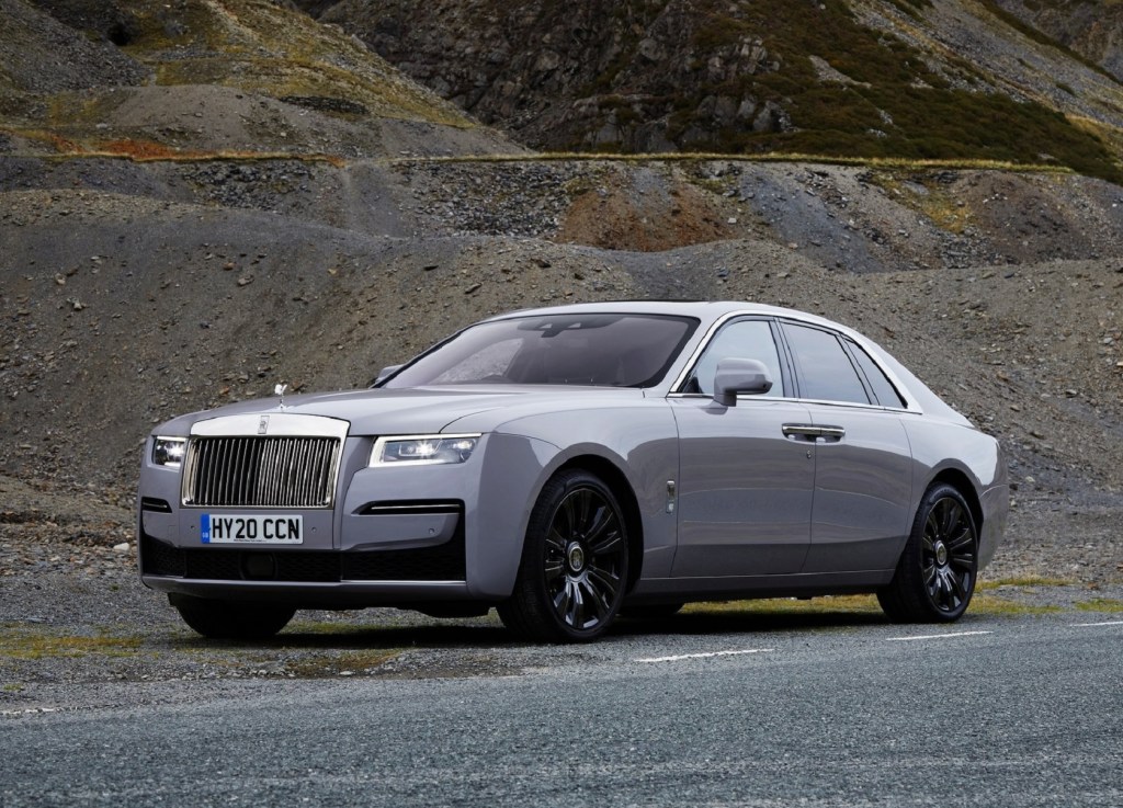 The side 3/4 view of a gray 2021 Rolls-Royce Ghost in a quarry