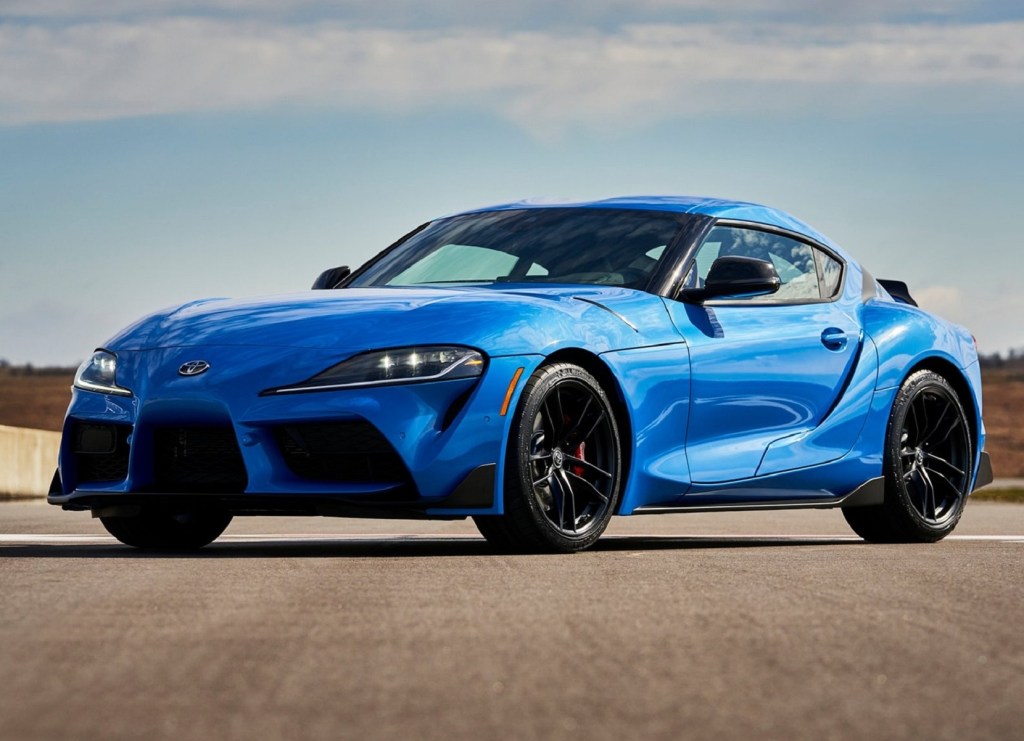 A blue 2021 Toyota GR Supra 3.0 parked on a racetrack