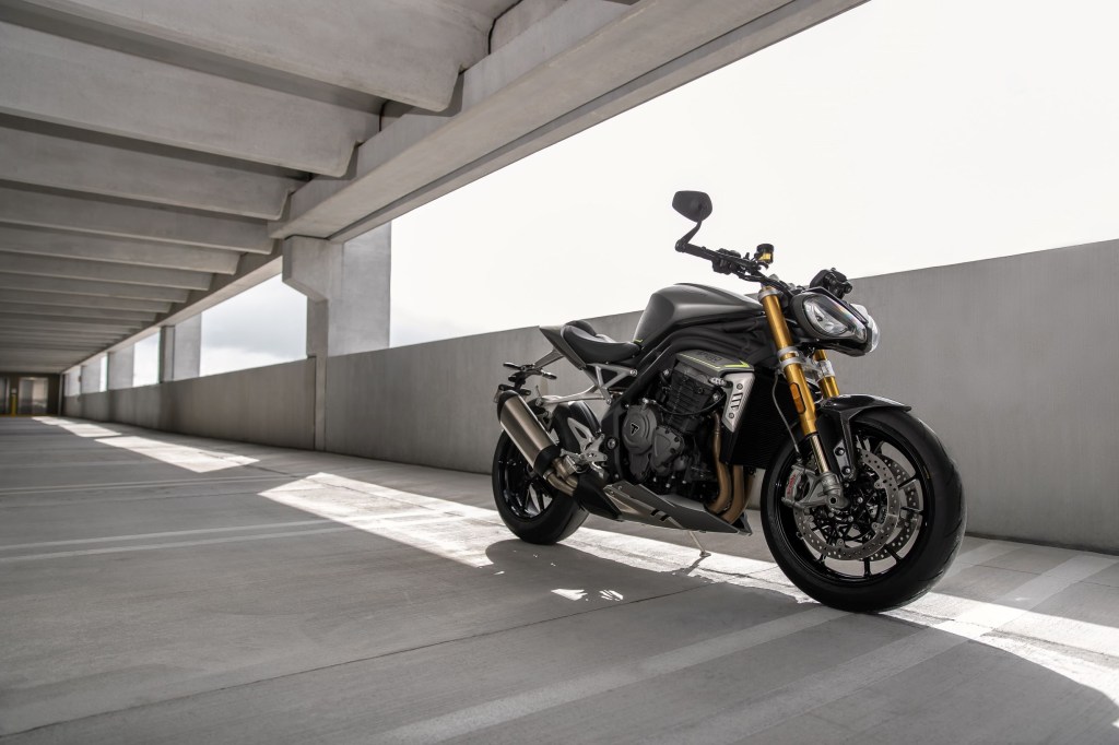 A gray-and-black 2021 Triumph Speed Triple 1200 RS in a parking garage