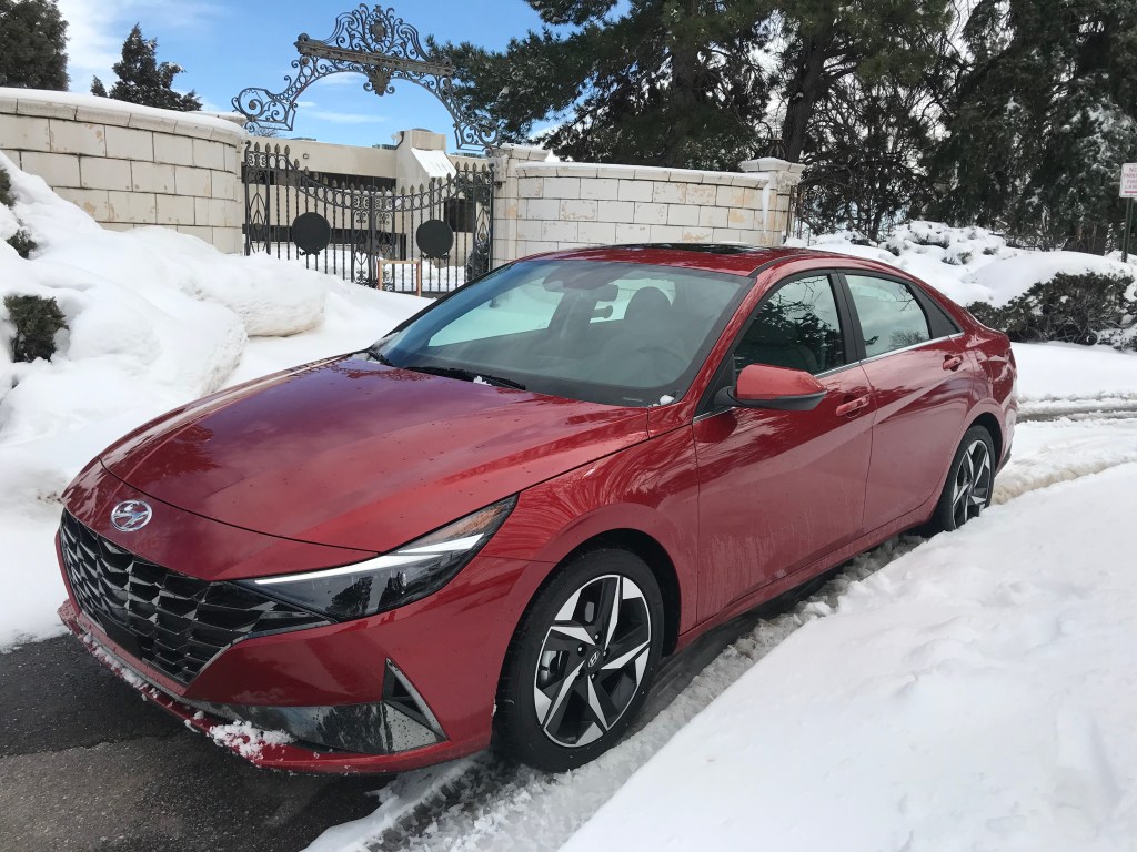 2021 Hyundai Elantra sits in front of a snow-covered gate
