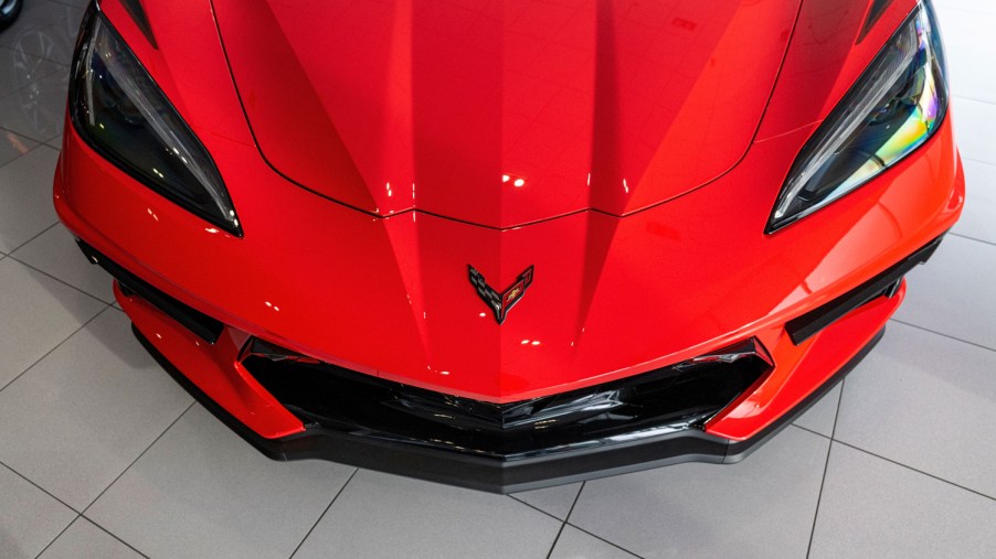 A red 2021 Chevrolet Corvette on display at a dealership