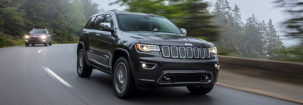 The 2021 Jeep Grand Cherokee driving on the road