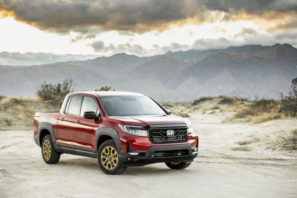 2021 Ridgeline Sport with HPD Package parked in the mountains named best new pickup truck of 2021 by Car and Driver