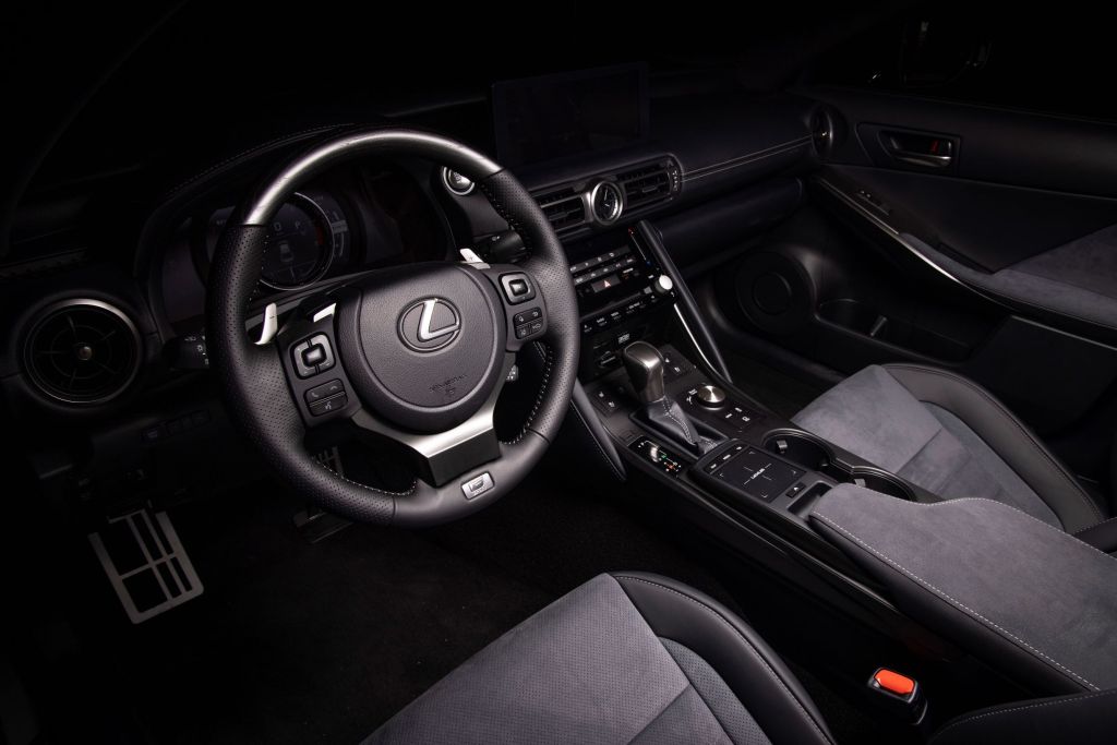 The black-and-gray suede-trimmed front seats and dashboard of a 2022 Lexus IS500 F Sport Performance Launch Edition