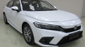 An image of a white 2022 Honda Civic ahead of its global debut.