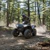 a 2021 Polaris Sporstman XP 1000 ATV in the forest