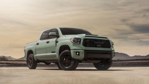 a 2021 toyota tundra trd pro in Lunar Rock shoing up its aggressive stance in the desert