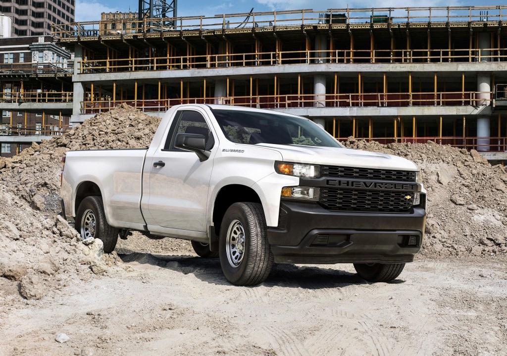 a white 2019 chevrolet silverado 1500 work truck on a construction site