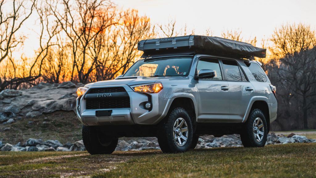the mountain state overland 4runner build parked in the grass in the woods