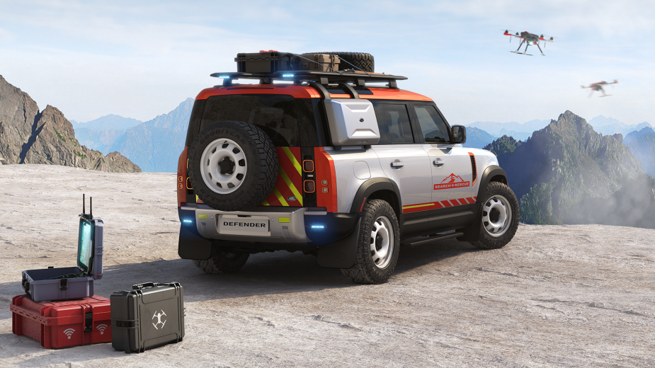 serach and resue land rover defender concept on the edge of a cliff escorted by flying rescue drones