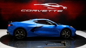 A blue Chevy Corvette on display at an auto show