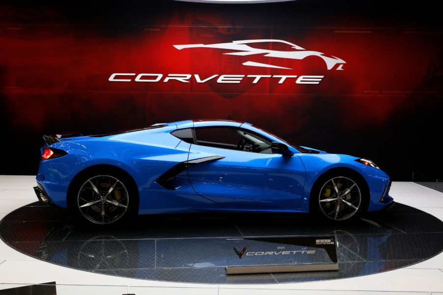 A blue Chevy Corvette on display at an auto show