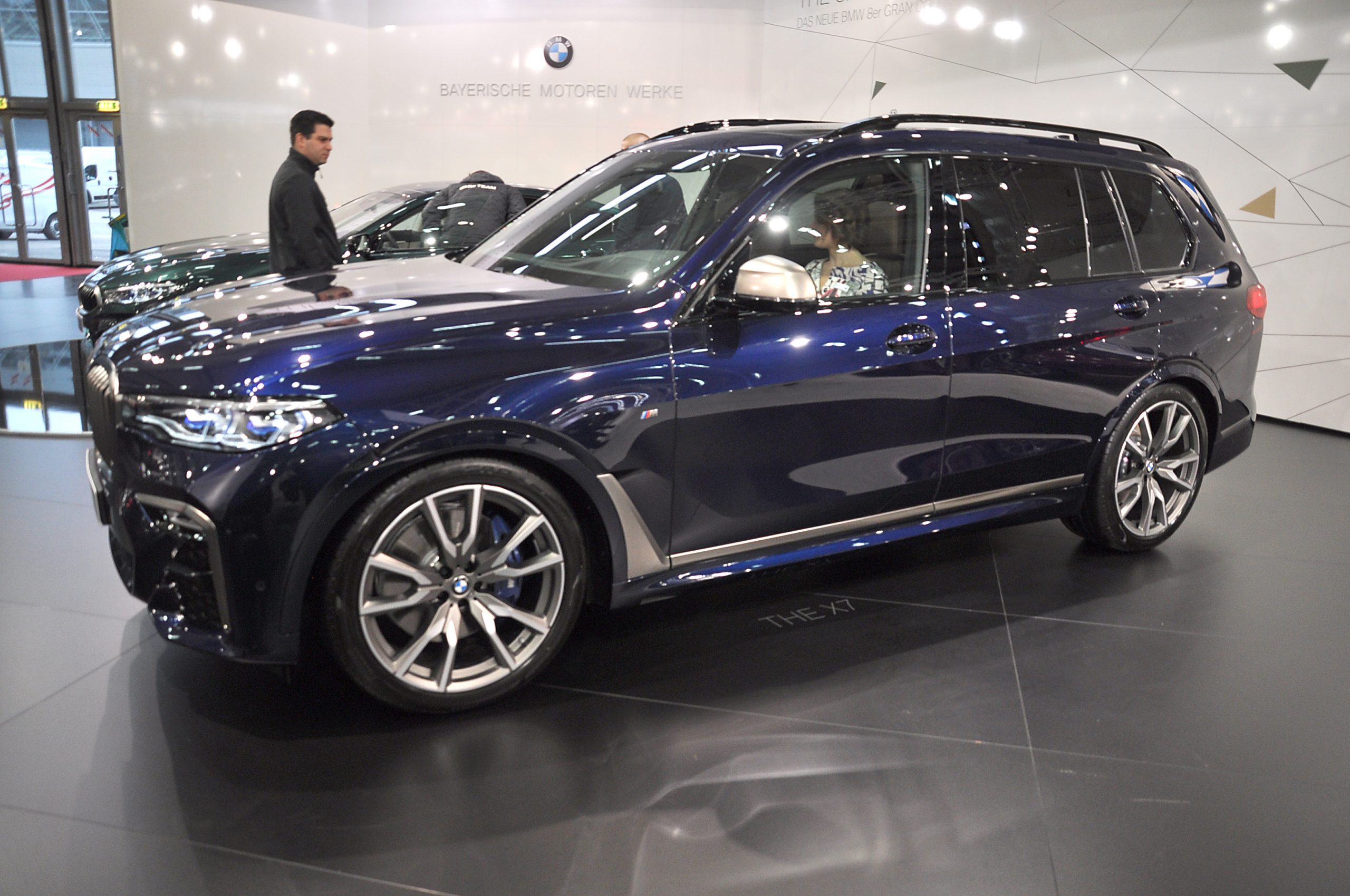 A BMW X7 on display at a car show