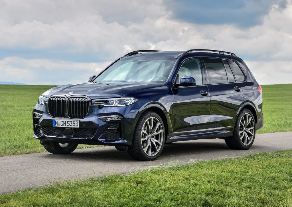 An image of a BMW X7, one of the luxury SUVs Consumer Reports recommends, parked outside.