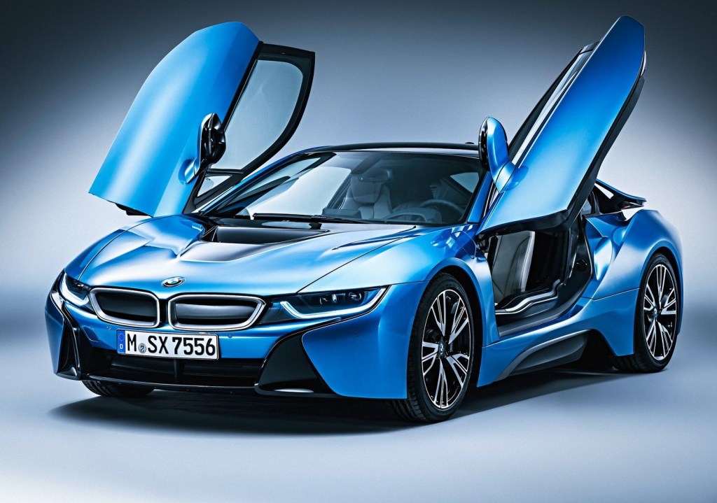 An image of a blue BMW i8 photographed inside of a studio.