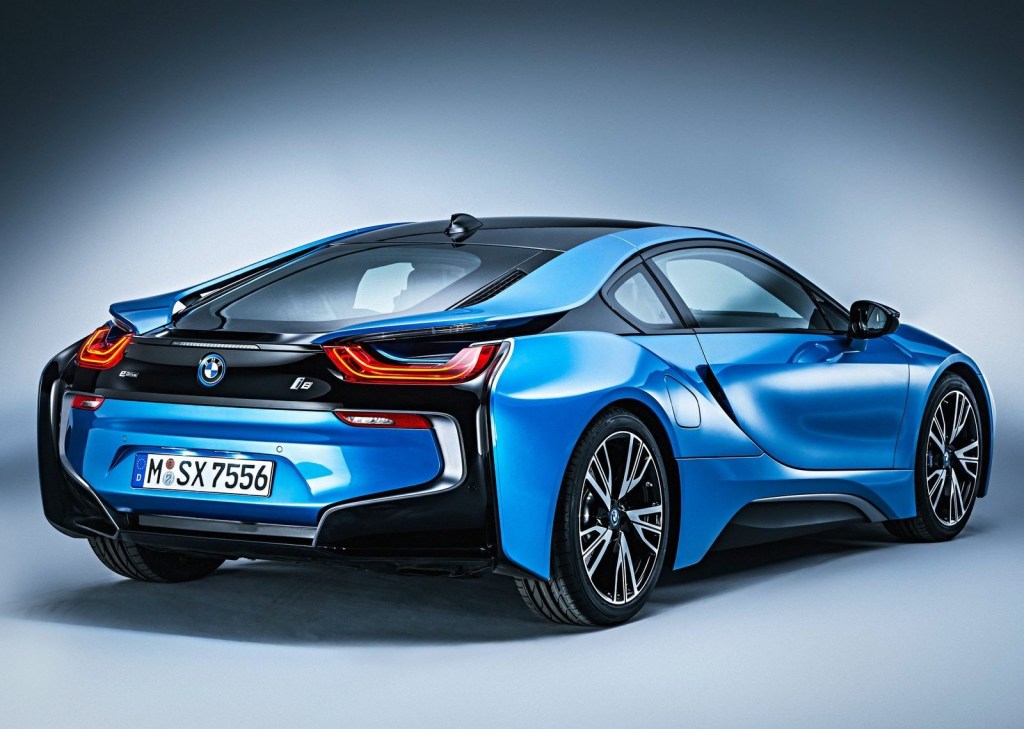 An image of a blue BMW i8 photographed inside of a studio.