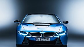 An image of a blue BMW i8 photographed inside of a studio.