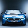 An image of a blue BMW i8 photographed inside of a studio.