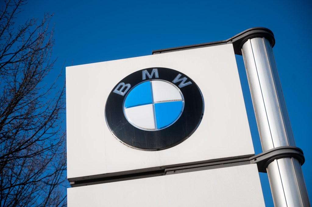 A BMW logo stands in front of the BMW plant in Berlin. At the end of the peace period in the metal and electrical industry, the employees have called for a warning strike