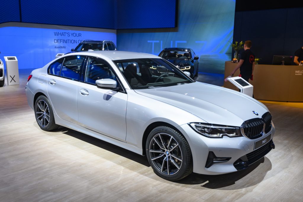 A Silver BMW 3 Series sedan sits on display at an auto show