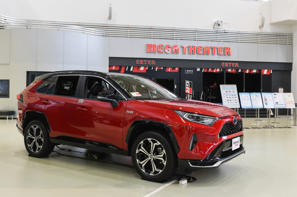 A red RAV4 plug-in hybrid Toyota SUV which is ranked as one of the quietest compact SUVs by Consumer Reports.