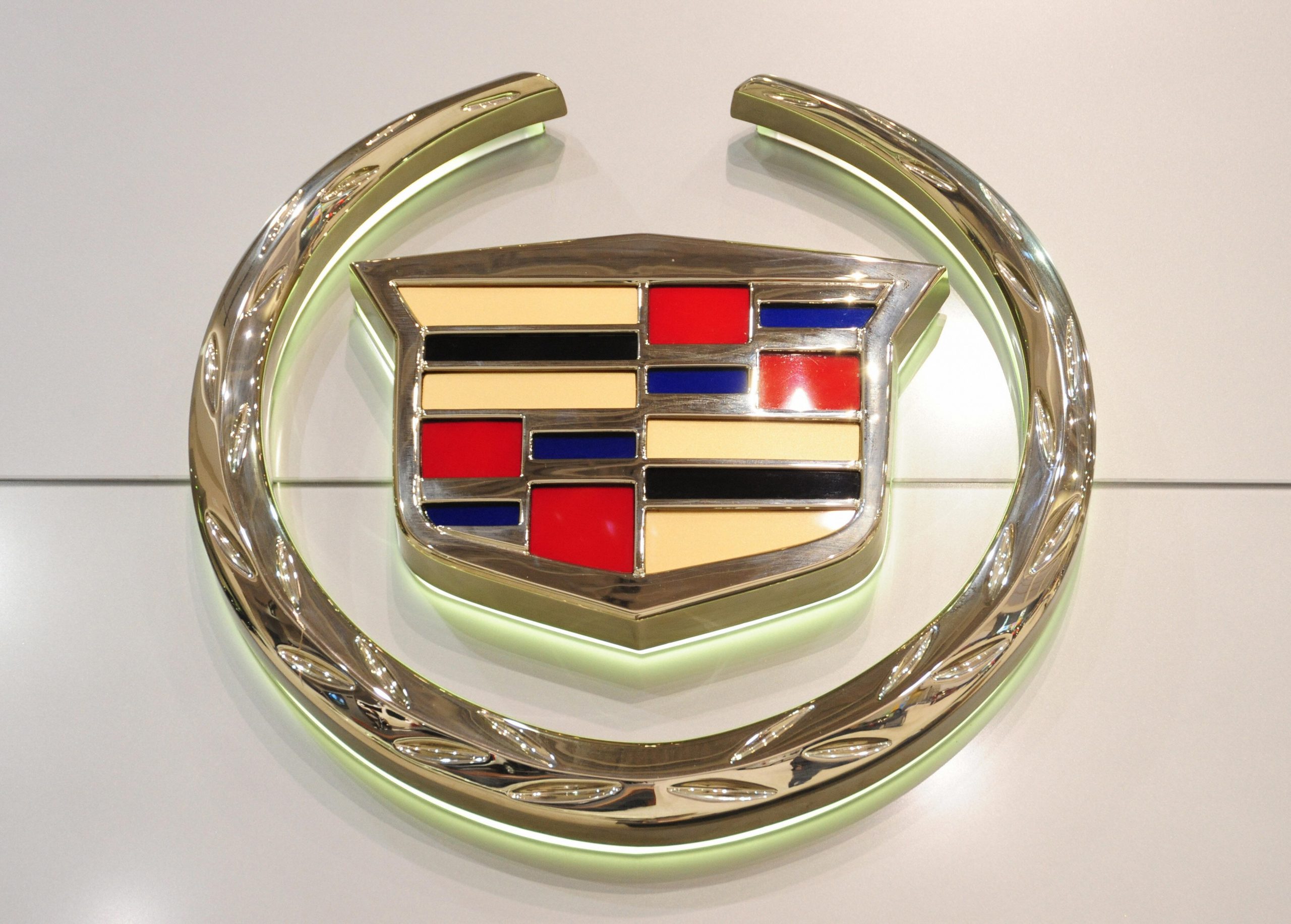 A Cadillac logo displayed on a sign representing one of General Motors luxury brands