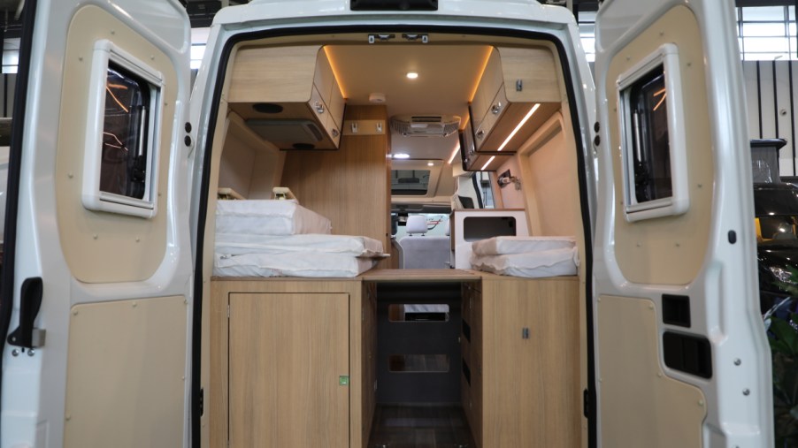 The rear entrance of a camper van on display