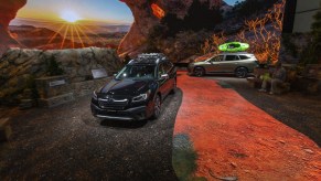Two Subaru Outback on display at an auto show