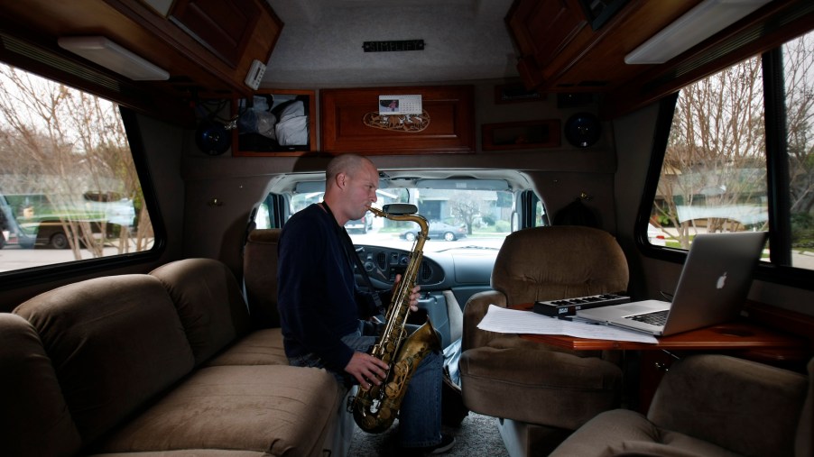 Composer and saxophonist Glenn Morrissette, 41, plays his saxophone in his Chinook Concourse RV while parked in the Studio City Recreation Center parking lot in LA's Studio City neighborhood