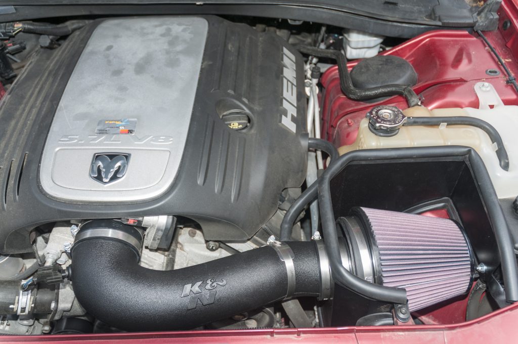 Cold air intake installed on a Dodge Charger Hemi V-8 engine.