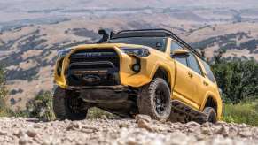 a rendering of a bright yellow 4runner climbing up a hill showing off a possible new TRD Pro color