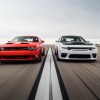 An image of a Dodge Challenger and Charger out on an airfield.