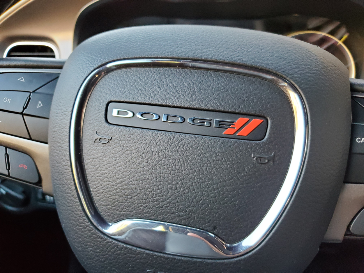 The Dodge logo seen on a steering wheel