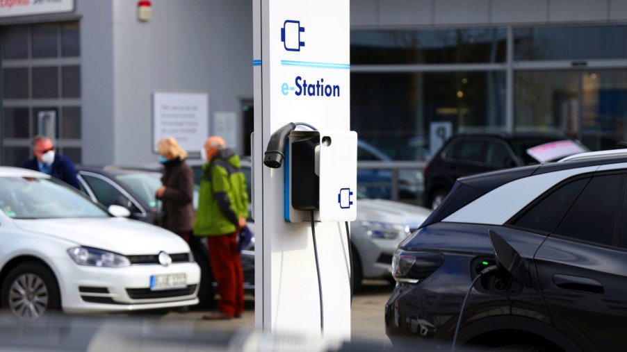 Public electric vehicle charging stations sometimes charge a fee