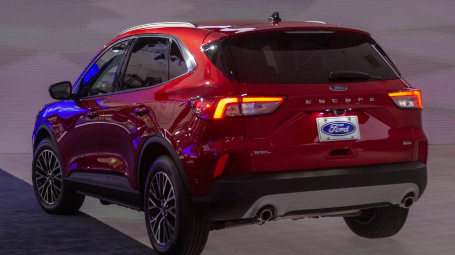 A Ford Escape Hybrid on display at an auto show