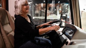 Penny Leon tests the driver's seat of a 2017 Forest River FR3 RV at the 27th-annual Colorado RV Adventure Travel Show at the Colorado Convention Center on January 6, 2017