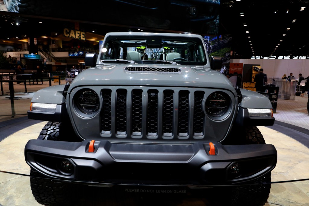 The front grille of a Jeep Gladiator on display at an auto show