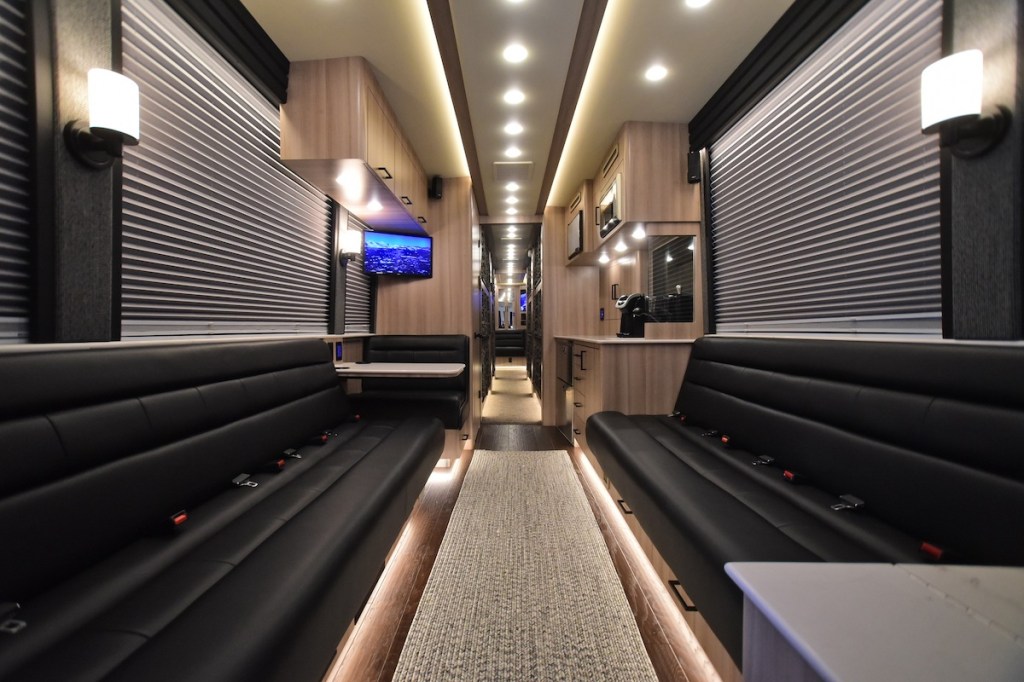 The black and beige lounge inside a Hemphill Brothers Coach Company luxury RV