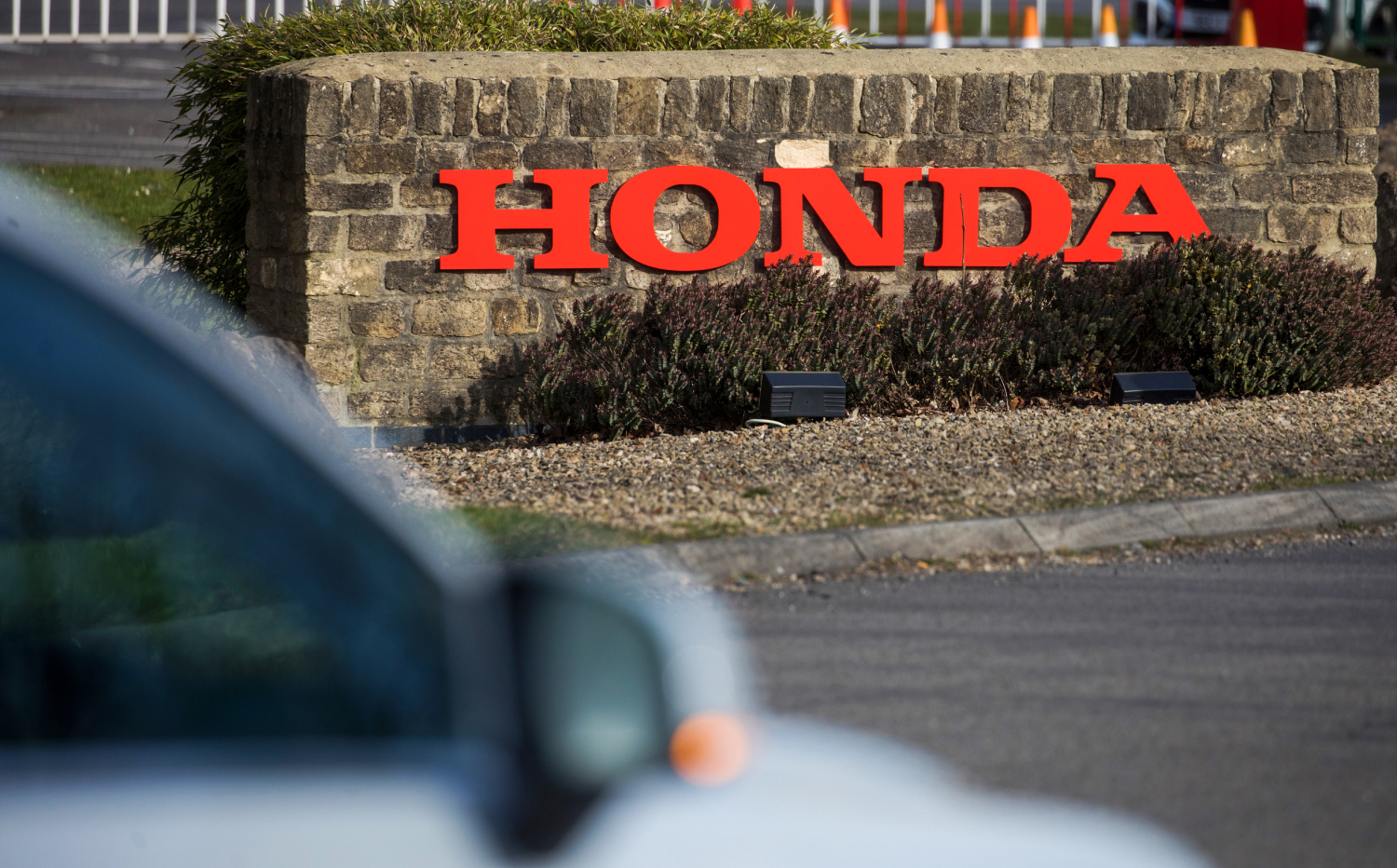 A Honda factory sign in the distance