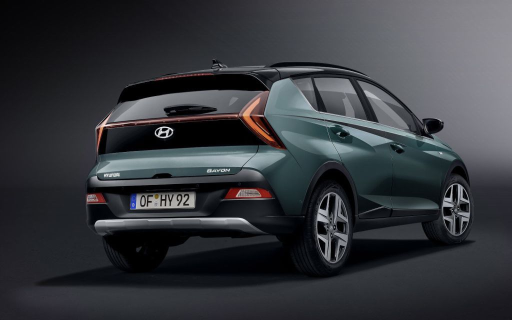 A look at the rear end and side of the Hyundai Bayon crossover in front of a grey background