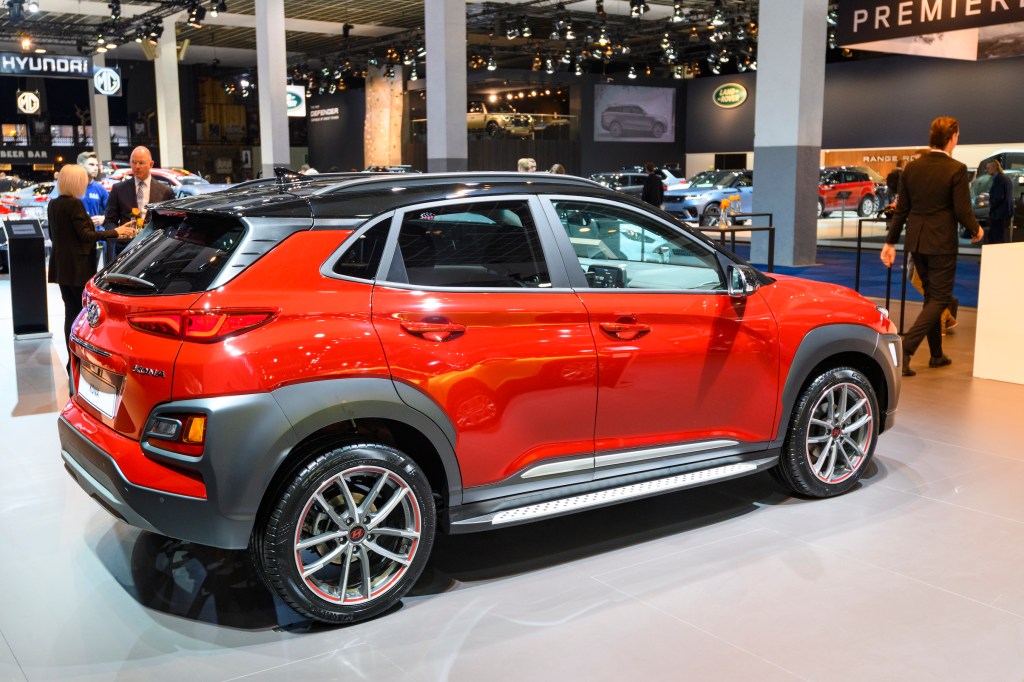 Red Hyundai Kona compact crossover SUV on display at Brussels Expo