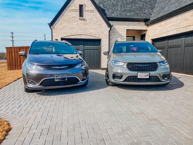 a 2020 and 2021 Chrysler Pacifica model side by side in a driveway
