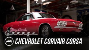 Jay Leno's red 1966 Chevrolet Corvair Corsa in his garage