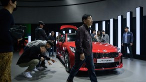 A Kia Stinger gets a lot of views at an auto show