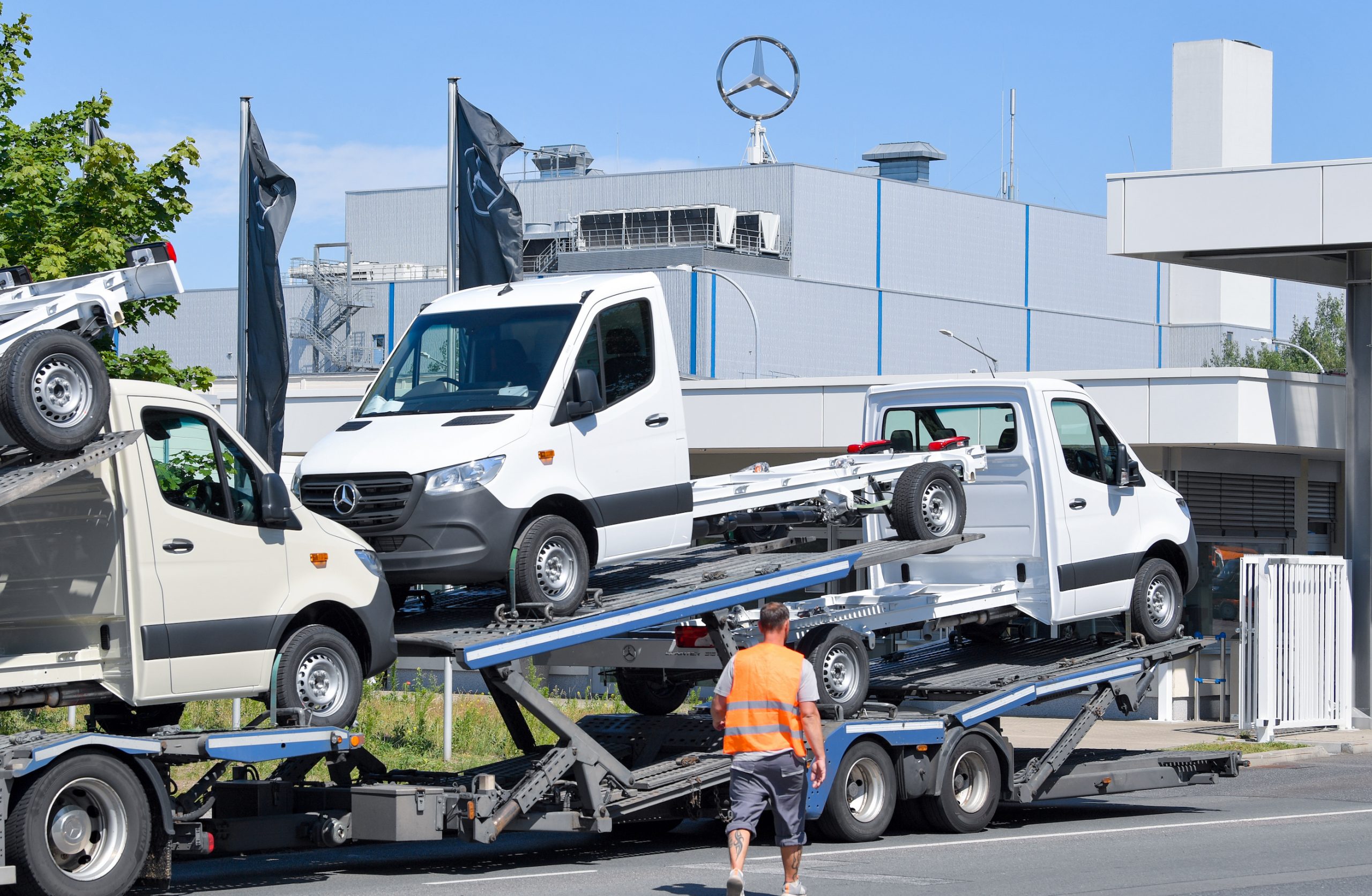 A car transporter loaded with Sprinter commercial vehicles leaves the Mercedes-Benz AG Ludwigsfelde plant