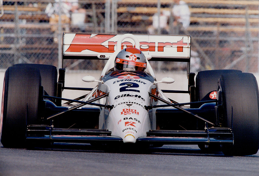 A white race car driven by Michael Andretti that inspired the design of the record-breaking car made of cake