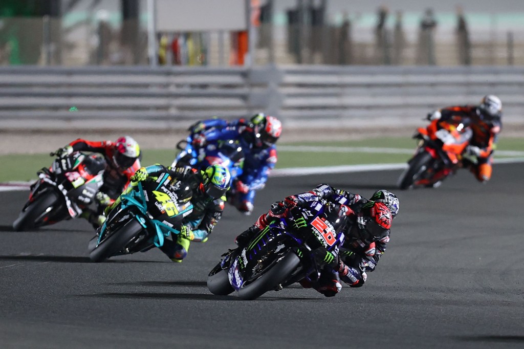 Monster Energy Yamaha racer Fabio Quartararo leads a pack of MotoGP riders at the 2021 Qatar GP