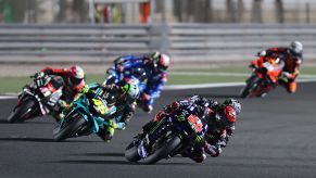 Monster Energy Yamaha racer Fabio Quartararo leads a pack of MotoGP riders at the 2021 Qatar GP