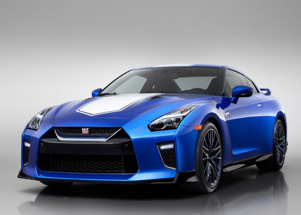 An image of a blue Nissan GT-R in a photo studio.
